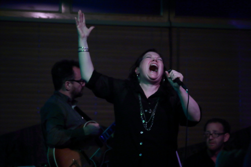 Evil Gal belting out the lyrics